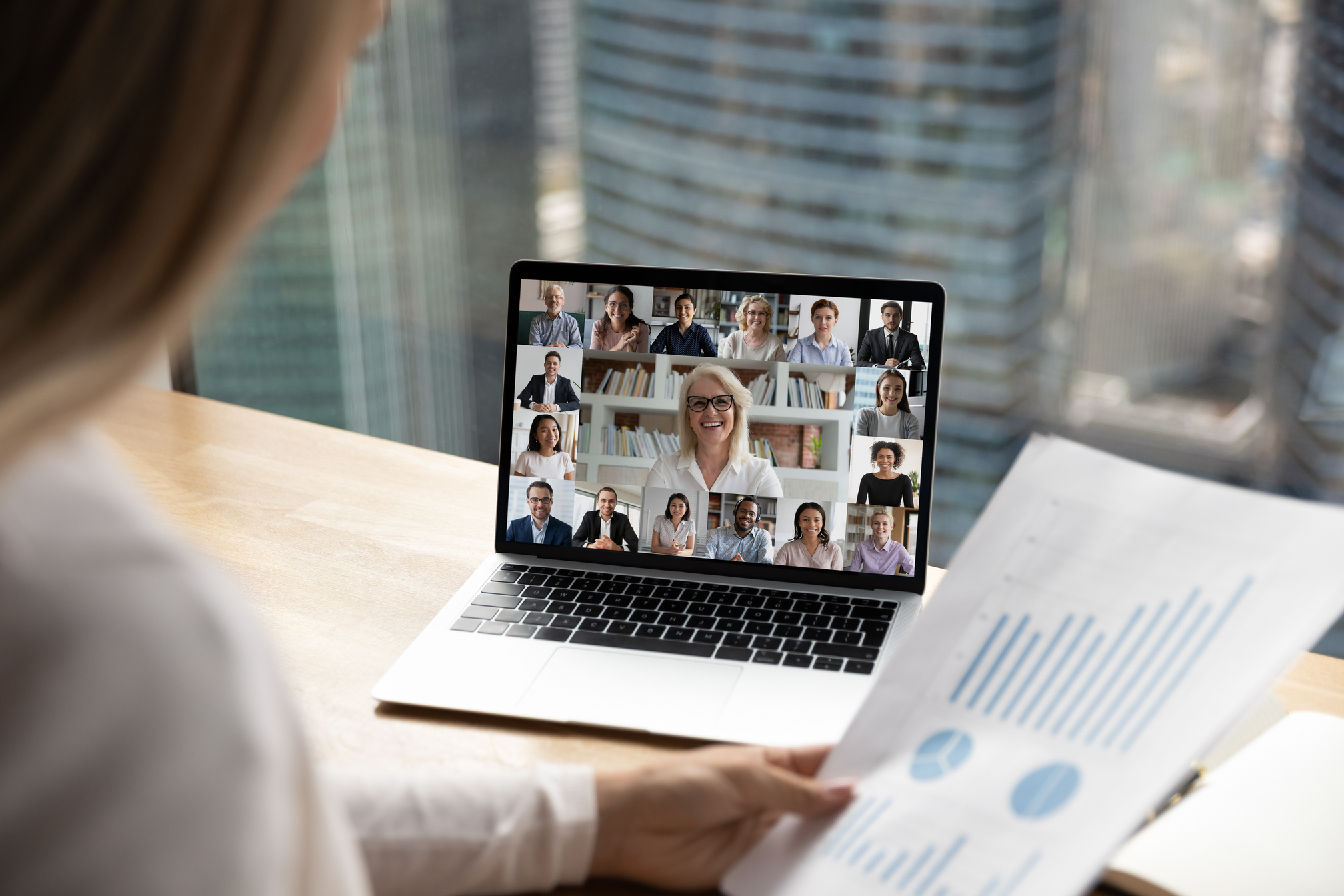 Diverse colleagues have online video zoom call on laptop